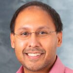 Professional headshot photo of Jon Audhya